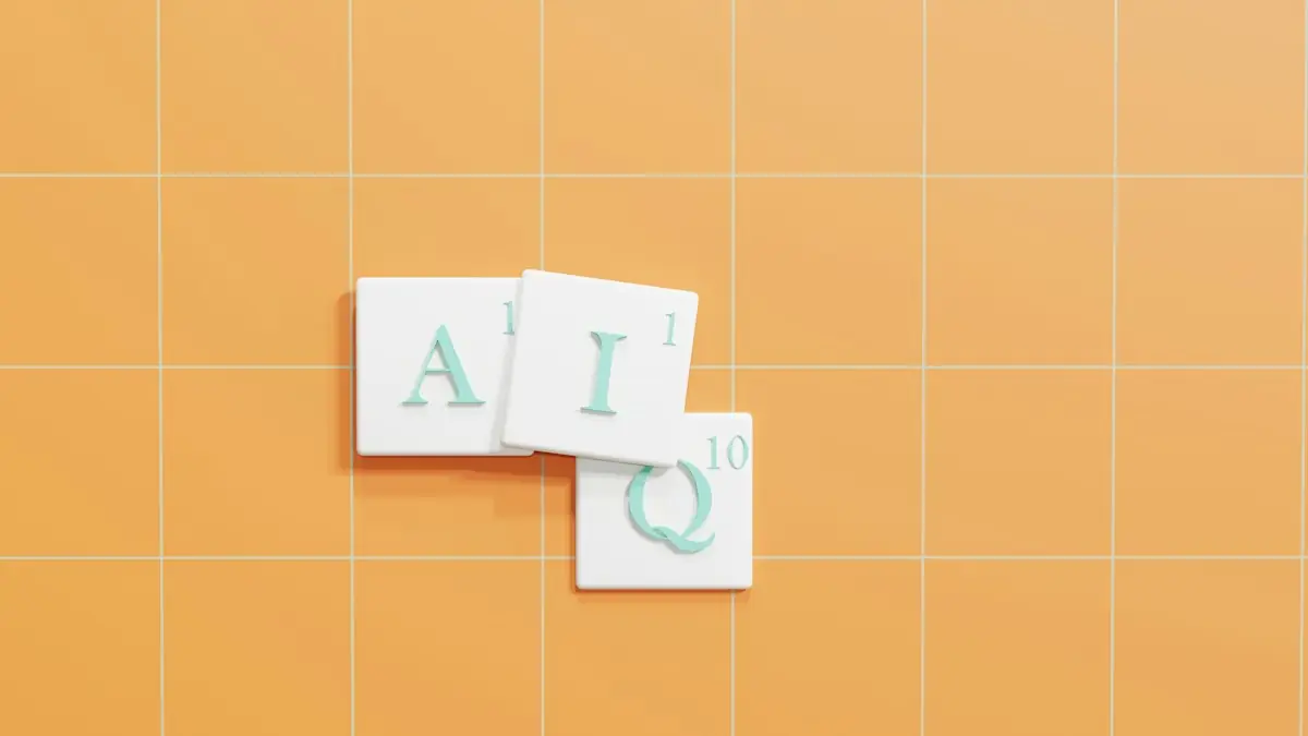 Letter tiles spelling A, I and Q on an orange grid