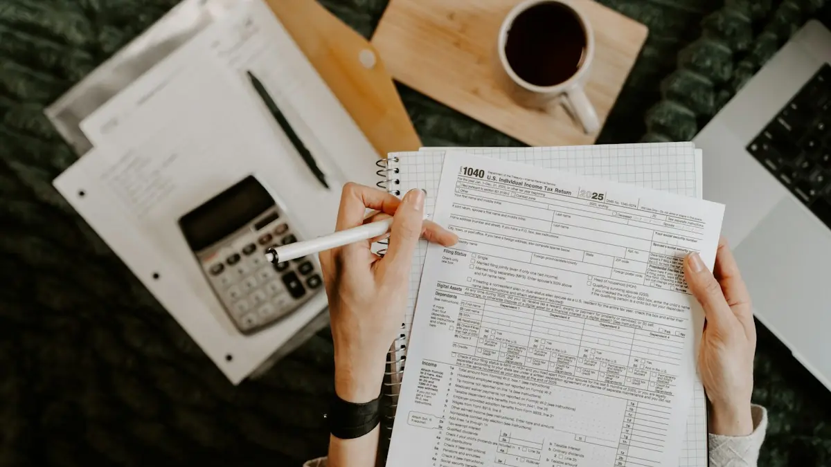 Hands holding a pen over a paper form on a desk with a calculator